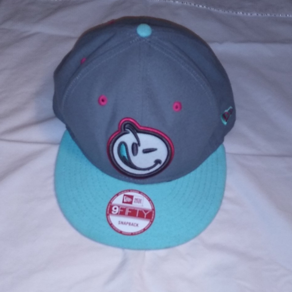 A grey,pink and white hat.